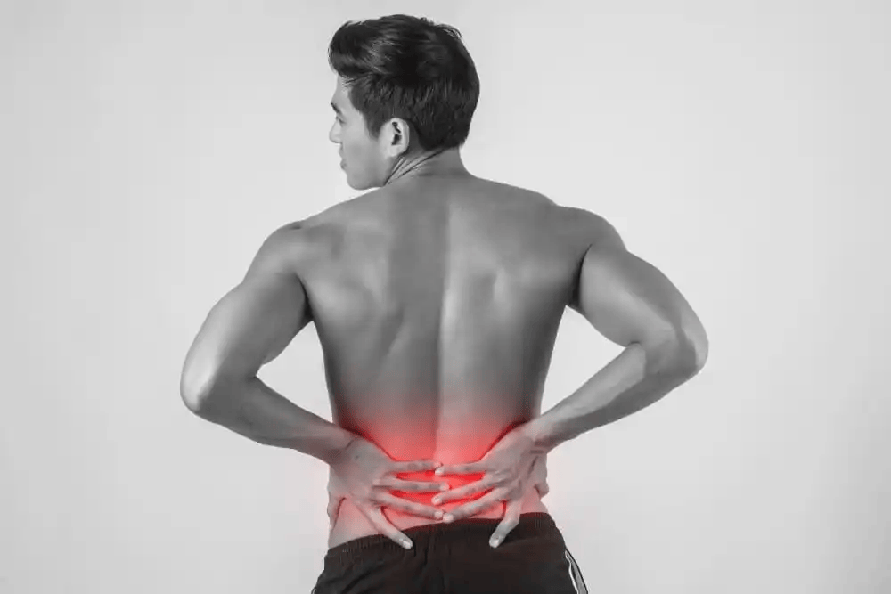 close-up-man-rubbing-his-painful-back-isolated-white-background.png